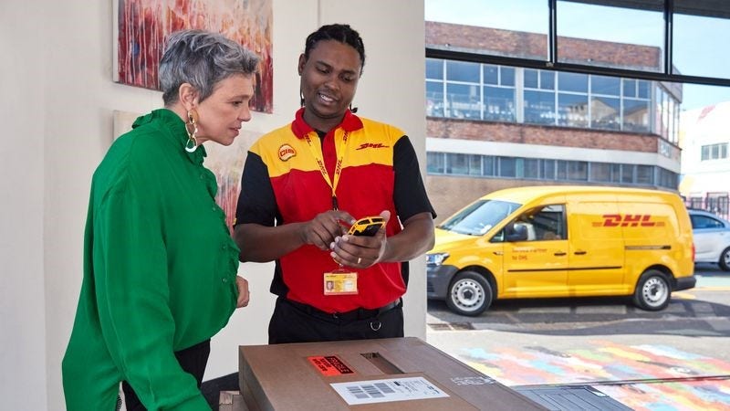 dhl express employee talking to consumer about parcel