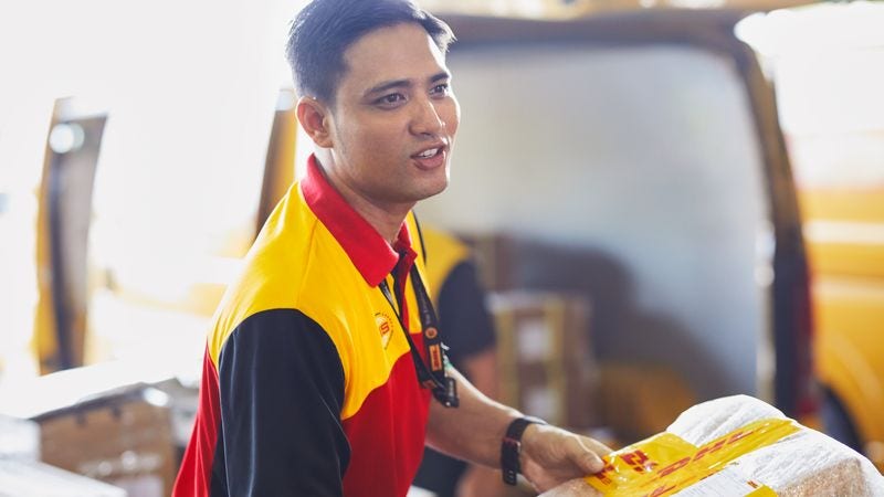 dhl express logistics staff preparing halal items for delivery