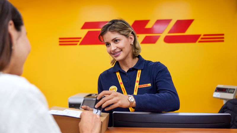 Female DHL express employee providing assistance to Pakistani’s logistics queries