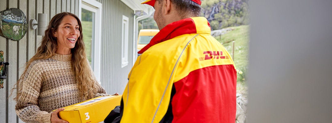 woman receiving parcel from DHL courier