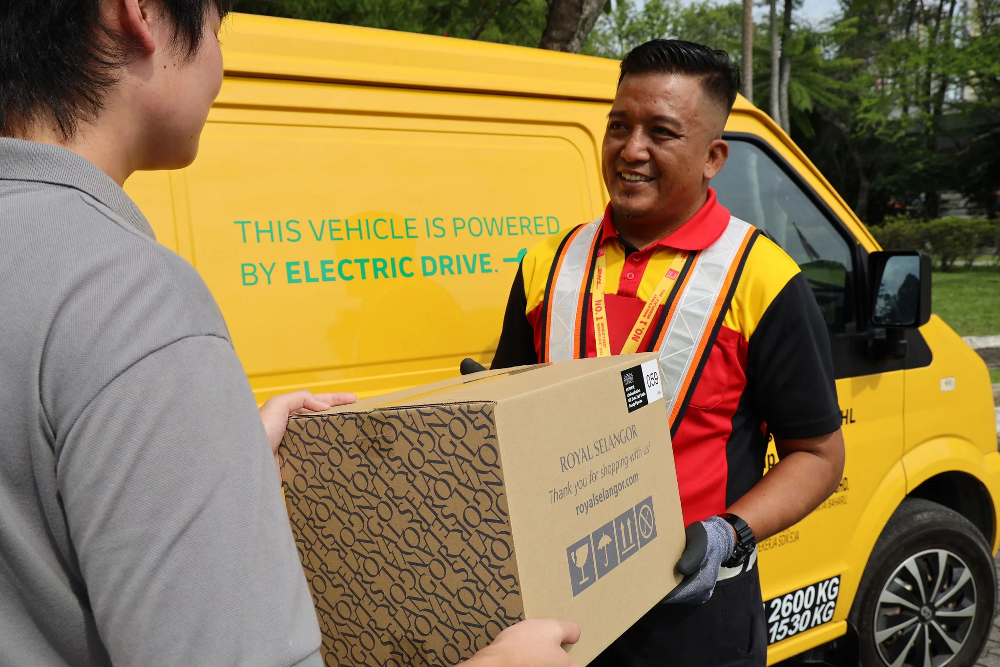 DHL Express courier picking up parcels from Royal Selangor