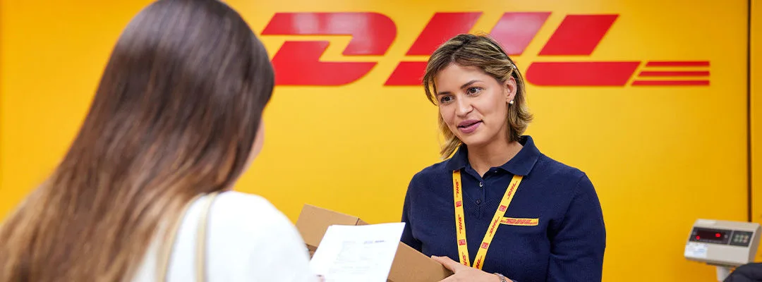 DHL employee speaking to customer