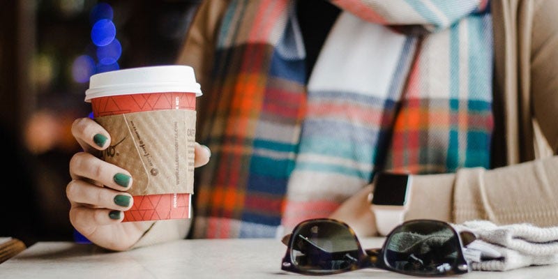 hand holding coffee cup