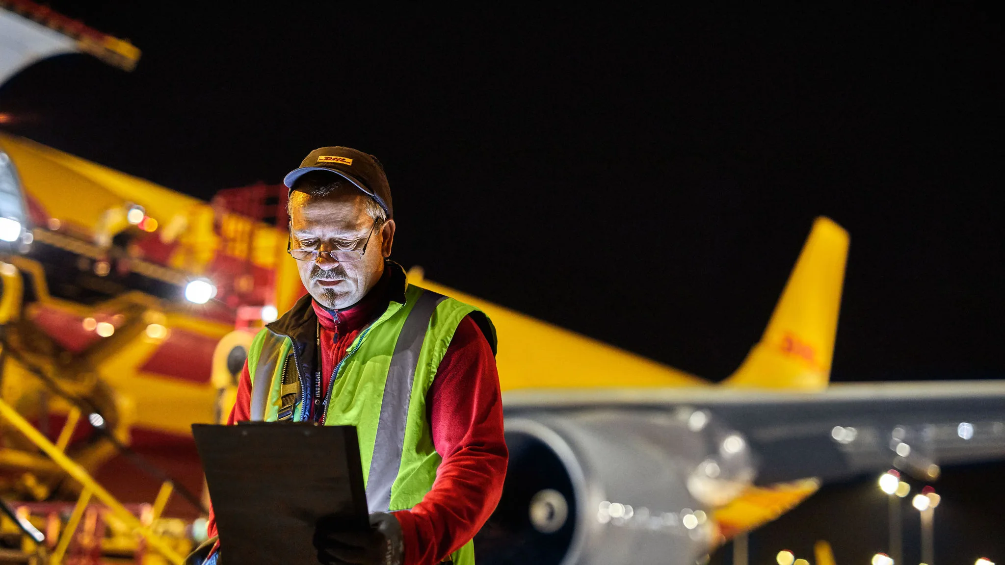 DHL Express staff on a tarmac