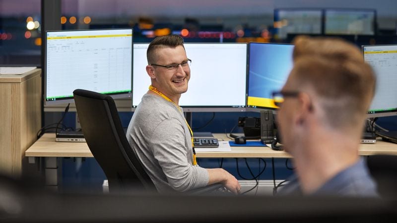 dhl staff securing shipment via portal