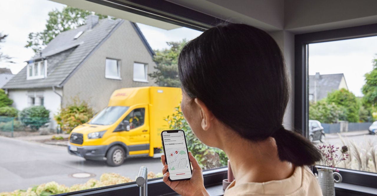 customer using phone for dhl parcel tracking