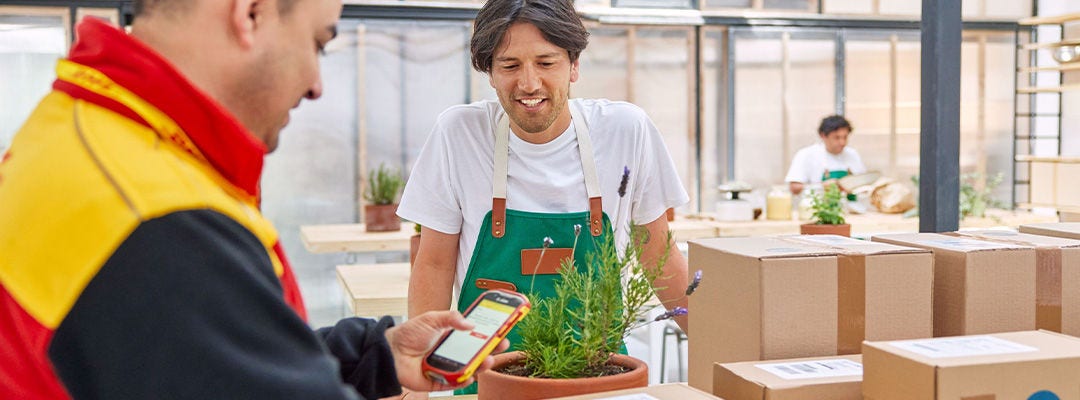 man smiling at DHL courier