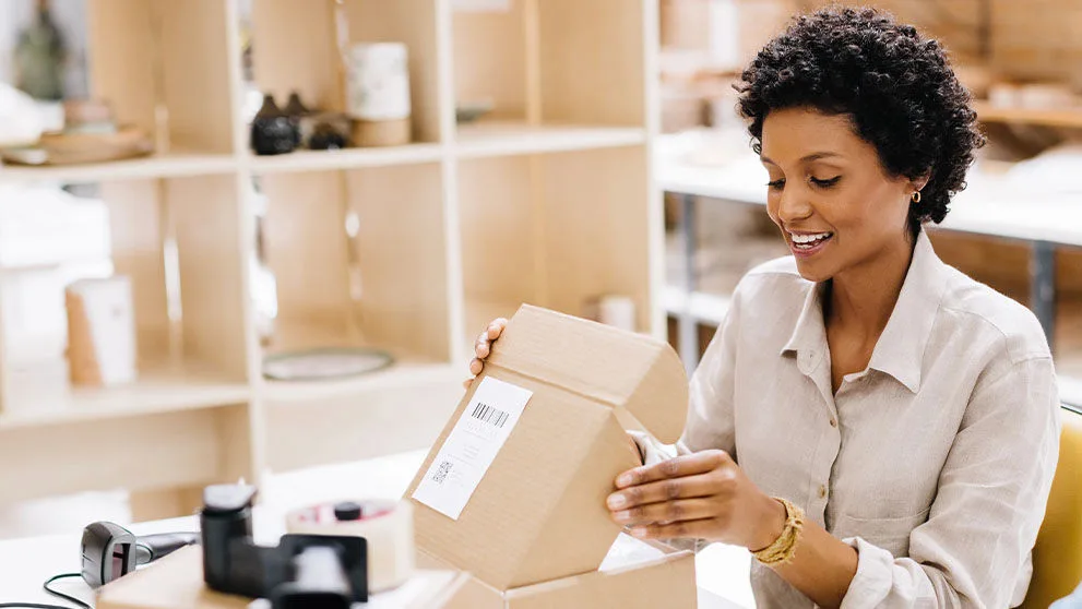 woman opening package