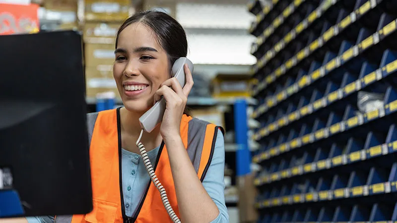 woman smiling at computer screen