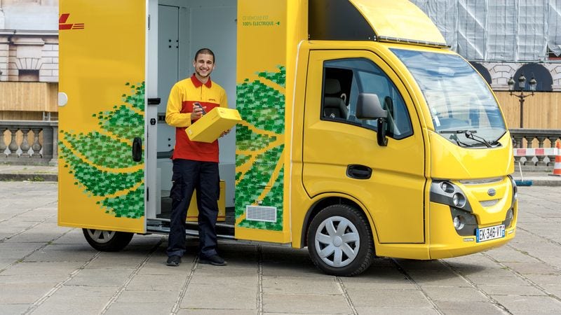 DHL Express ecological van on the road, promoting sustainable business practices with eco-friendly transportation solutions