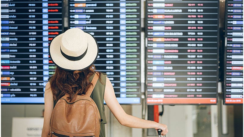 woman looking at information board