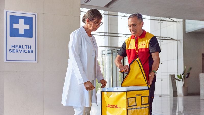 dhl staff delivering medical equipment through wmx