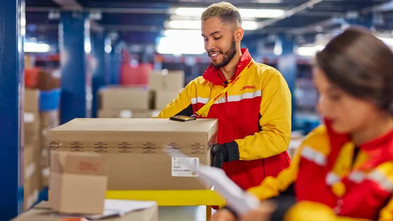 dhl workers handling shipments of products for export to india