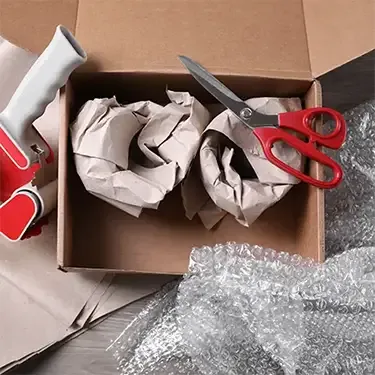 items being packaged in a brown box