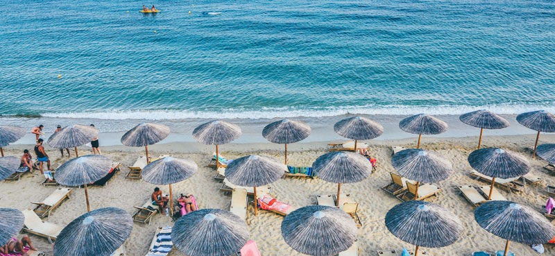 Beach with straw umbrellas