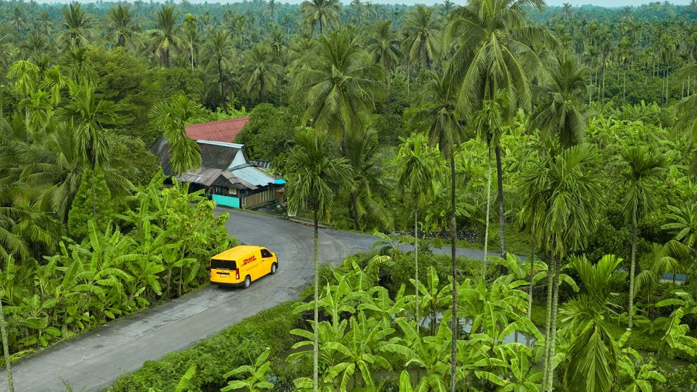 dhl express vehicle en route to collect a coffee shipment