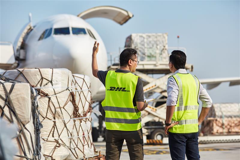 dhl employees managing shipments