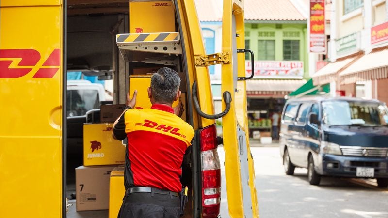 dhl express courier delivering parcels during peak holiday season sales