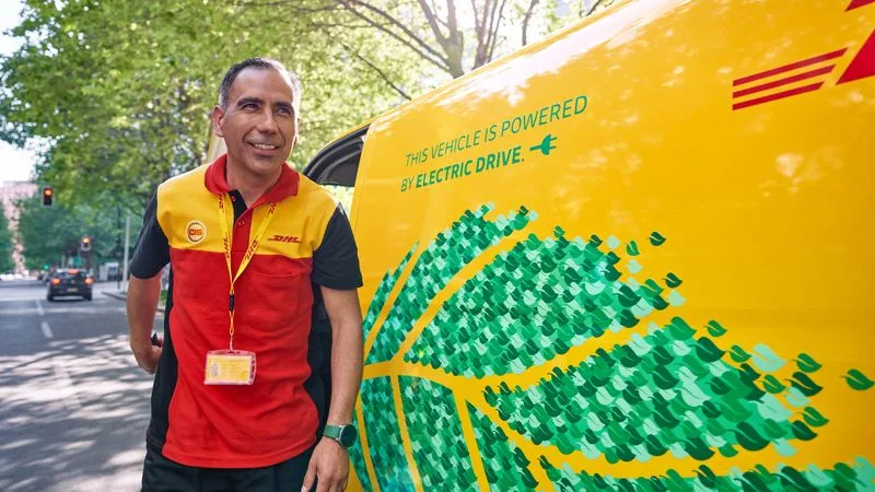 a dhl staff delivering sustainable toys using an electric van