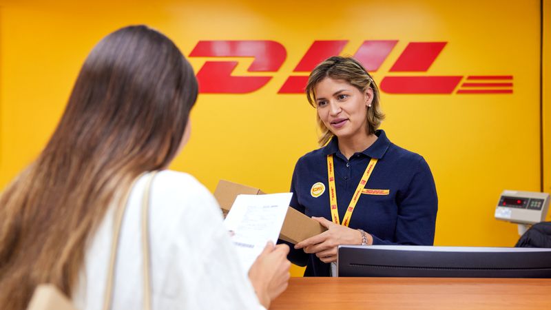 dhl employee discussing sustainable logistics options