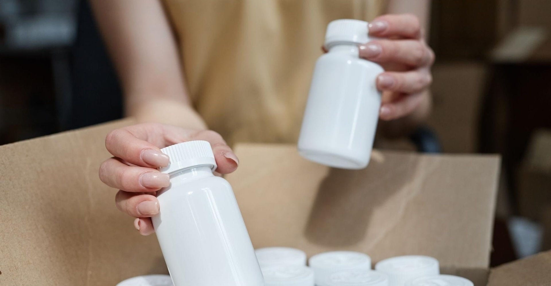 Medical personnel packing pharmaceutical products for export