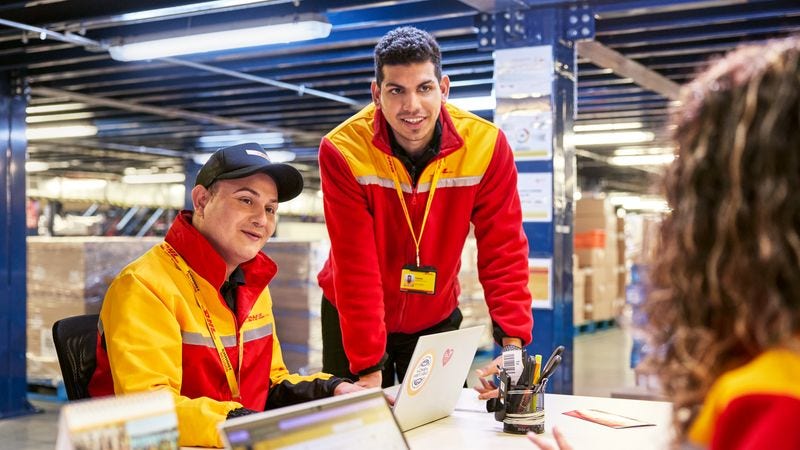 dhl staff process reverse logistics arrivals at a warehouse