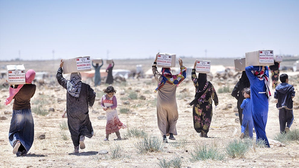 children carrying boxes