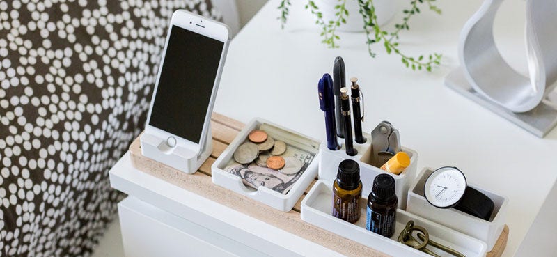 Desk organiser with phone, pen, money and watch