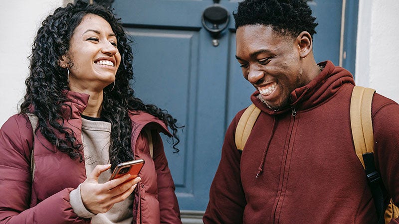 man and woman laughing