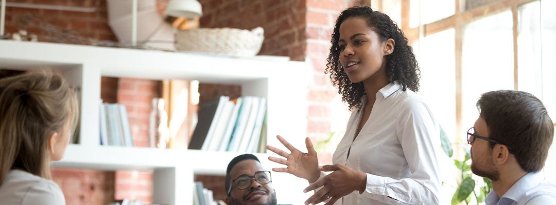 woman speaking to a group of people