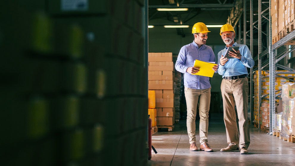 two men in a warehouse