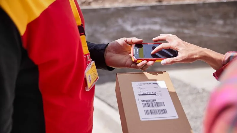 DHL employee delivering the trending e-commerce product to the customer