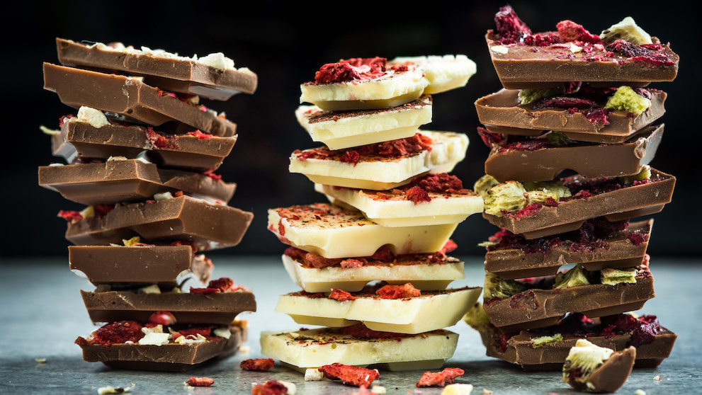 Handmade artisan chocolate pieces in stacks.