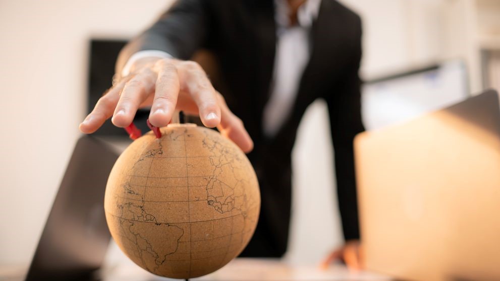 A man holding a globe