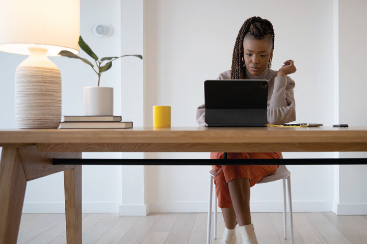 Jahmeelah “Jam” Gamble working at her desk 