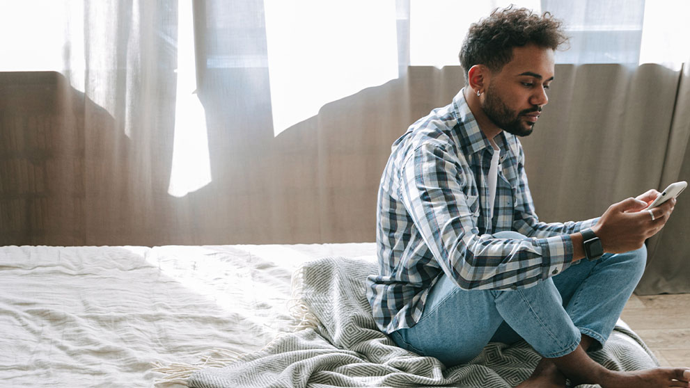 man looking at mobile screen