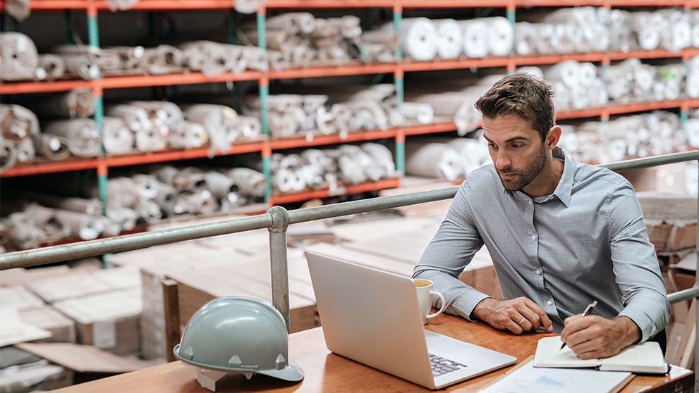 man looking at laptop screen