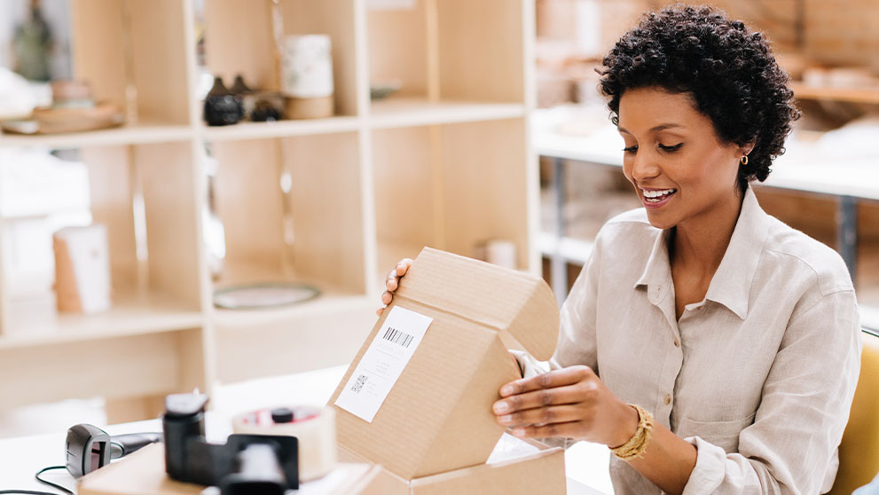 woman opening package