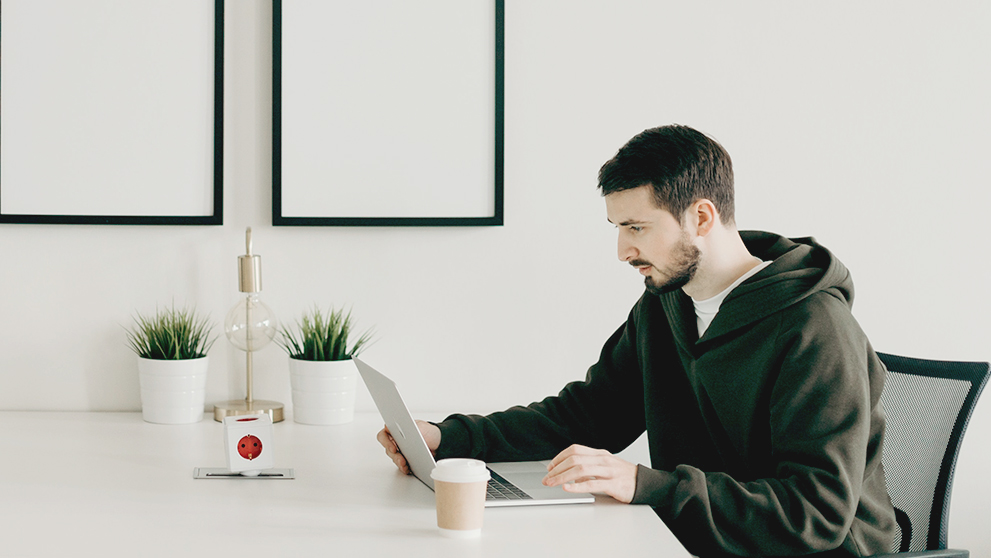 man looking at laptop screen