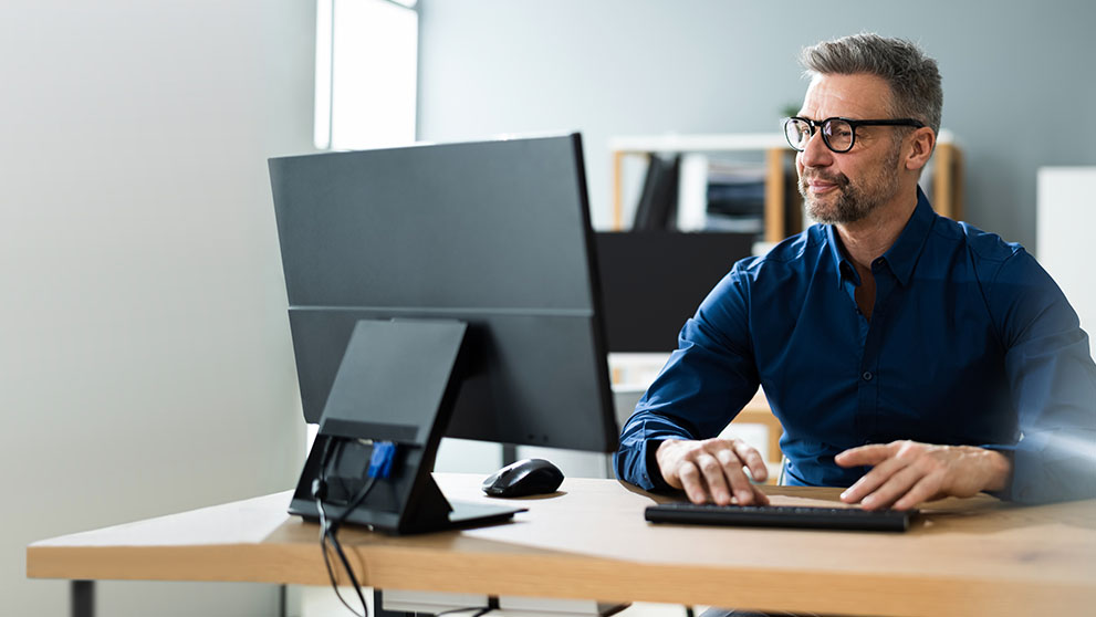 man looking at computer screen