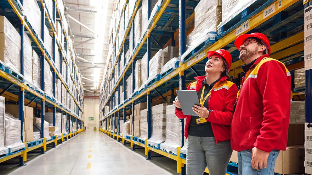 man and woman in a warehouse