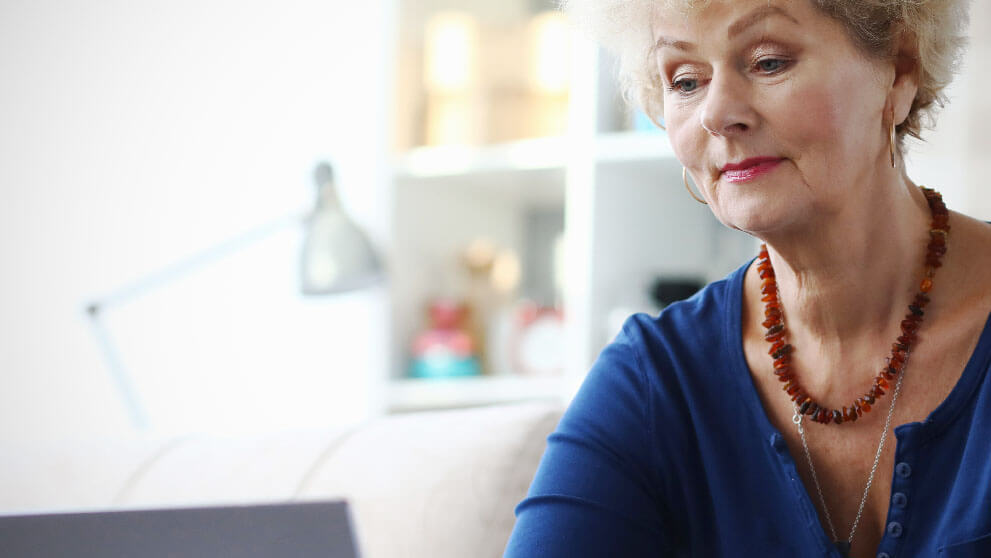 woman smiling in laptop screen