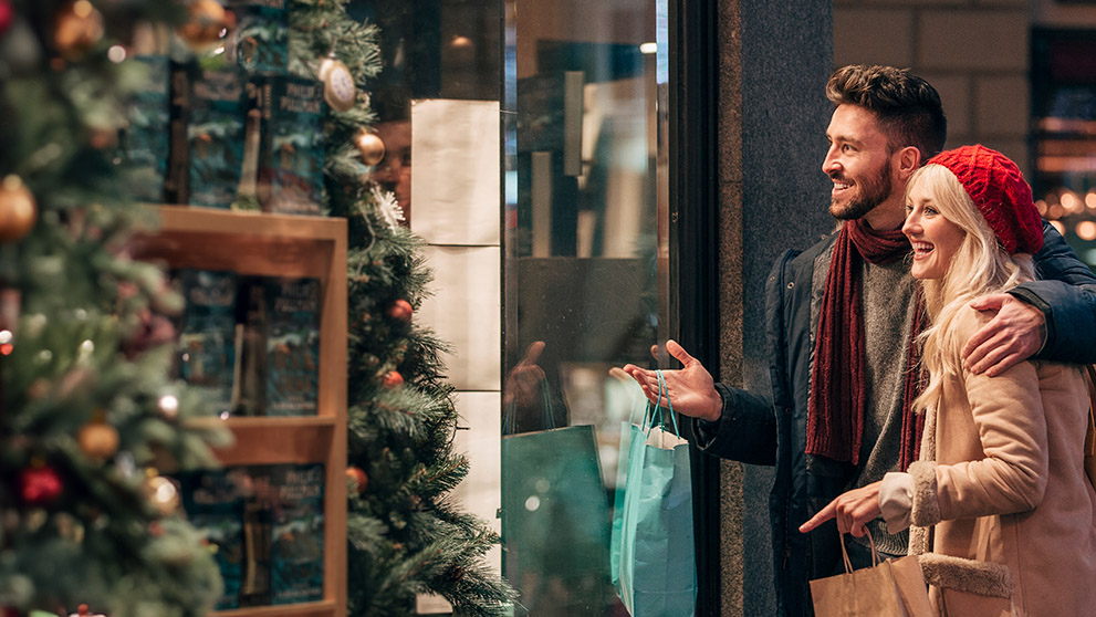 man and woman window shopping