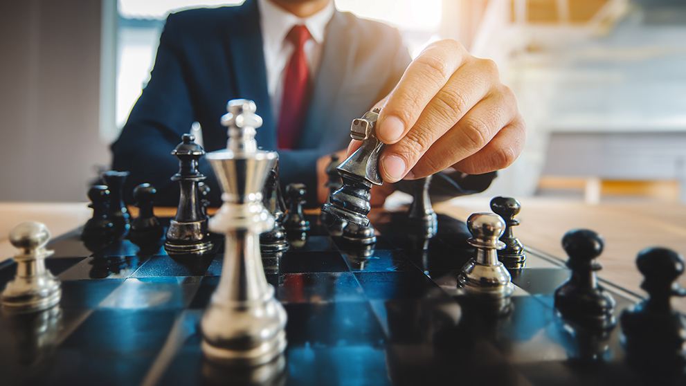 hand playing chess