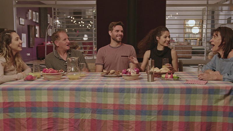 family sitting around dining table