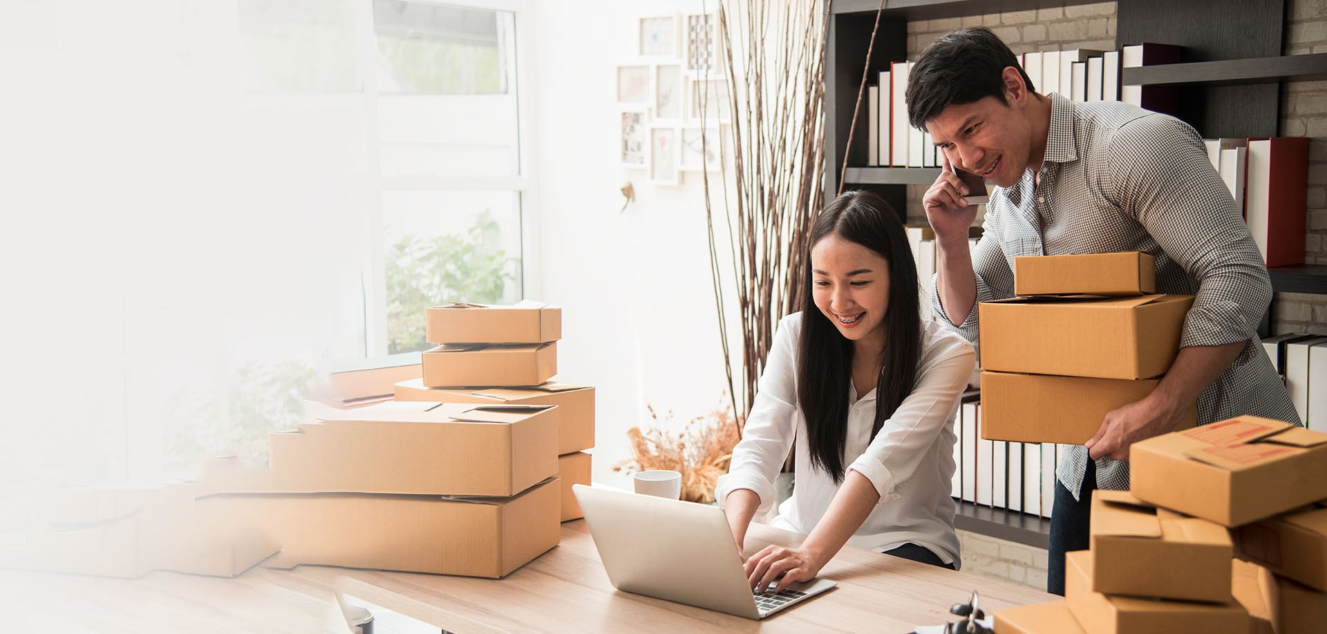 man and woman arranging brown packages