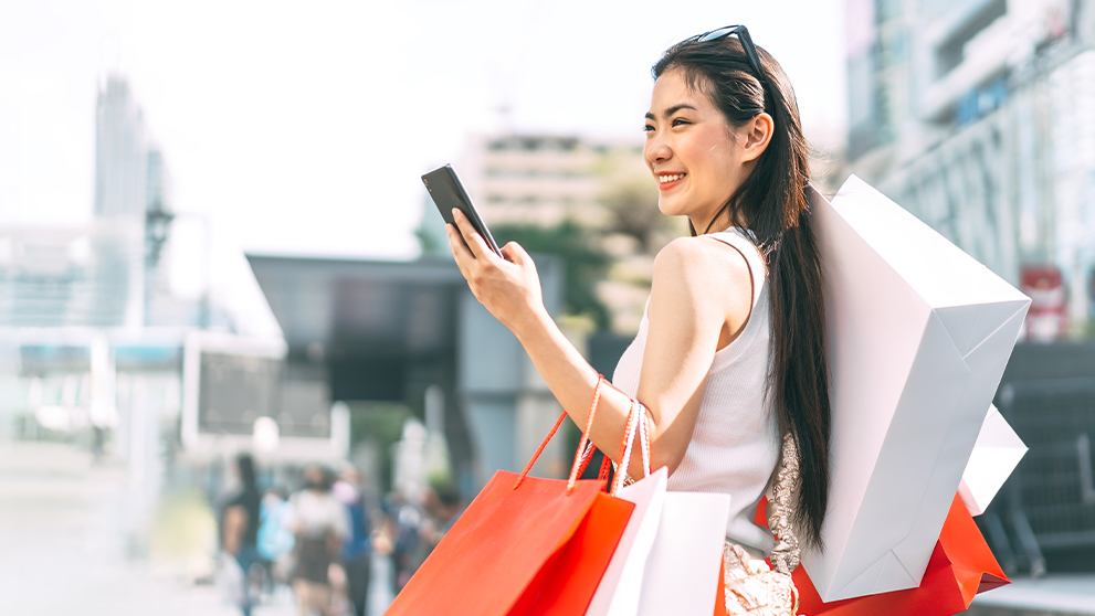 woman holding shopping bags