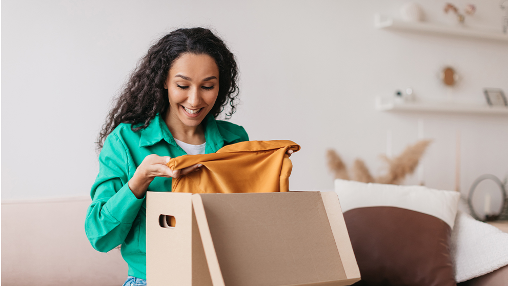 woman looking at orange top