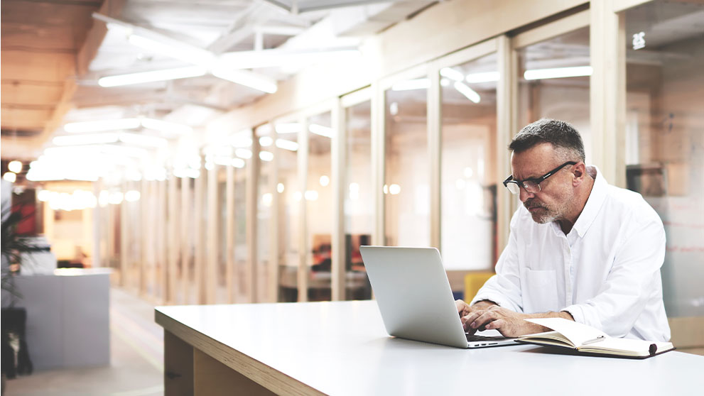 man looking at laptop screen