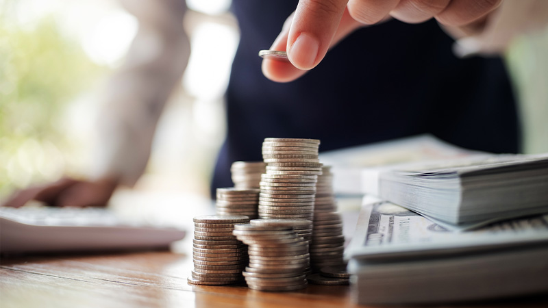 hand stacking coins